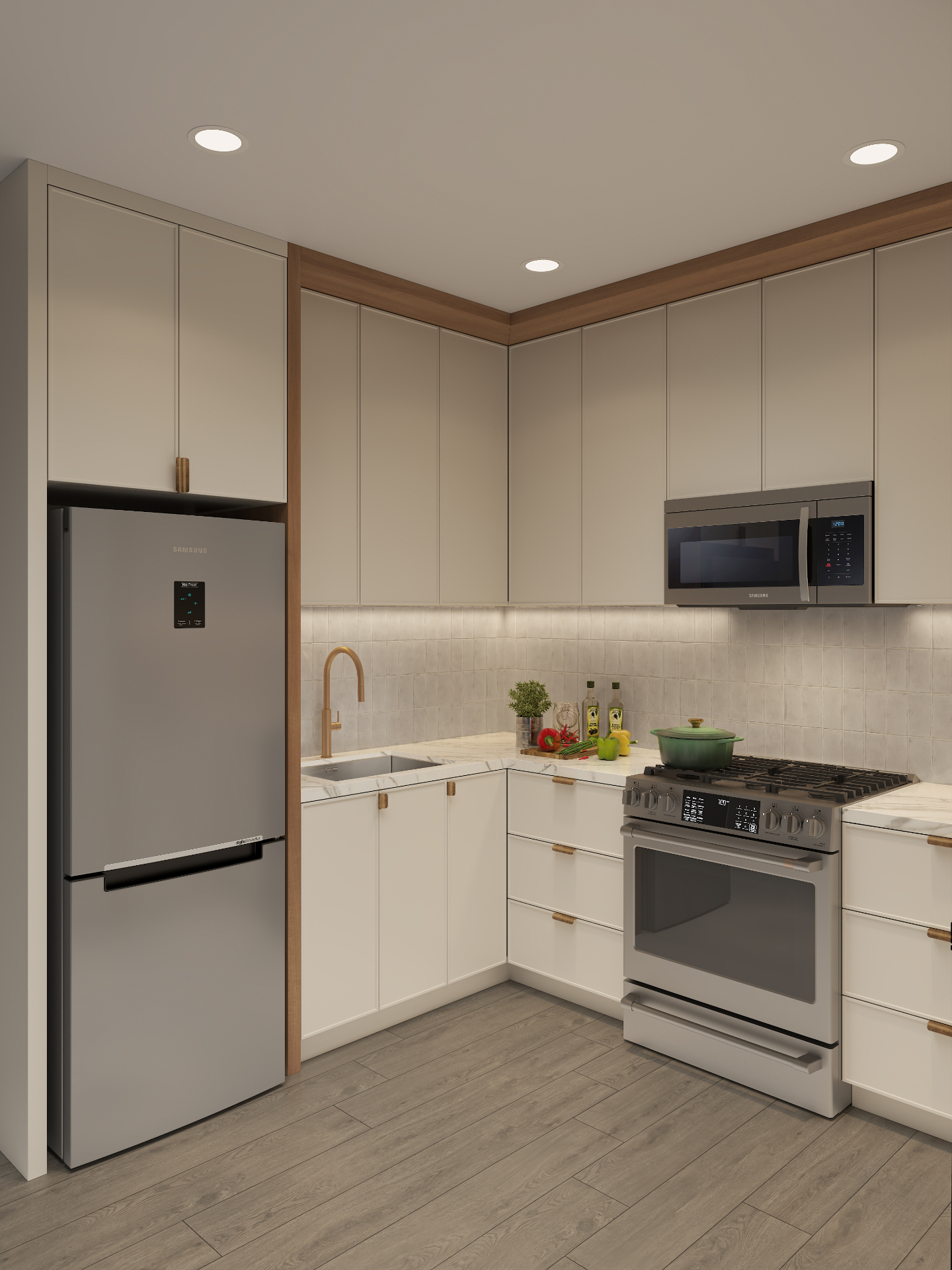 Corner kitchen view with tall cream cabinetry, brass hardware and integrated appliances