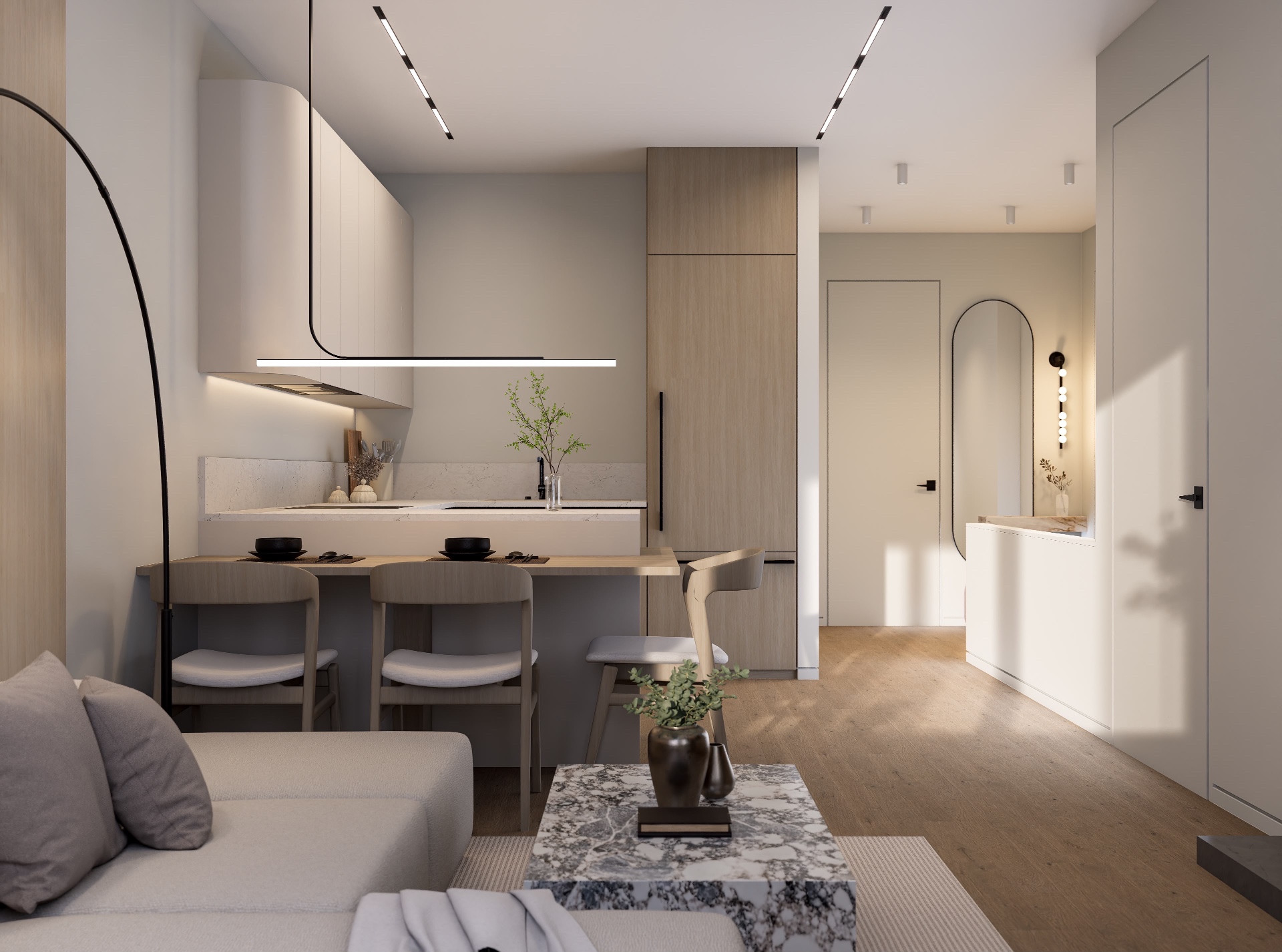 Living room looking past the kitchen peninsula toward the entry with oval mirror and marble ledge