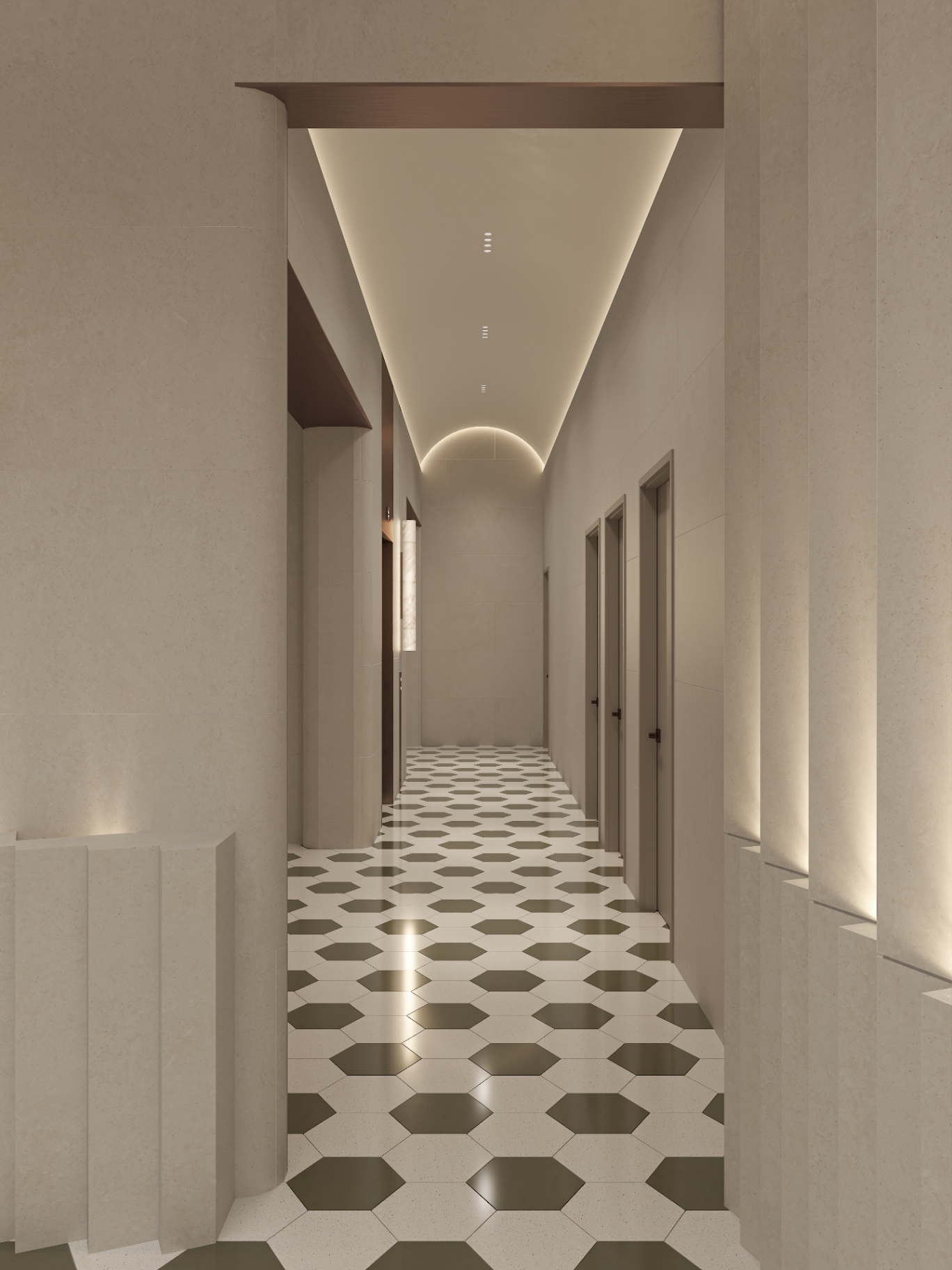 Lobby corridor with hexagonal terrazzo floor, limestone piers and a barrel-vaulted cove ceiling