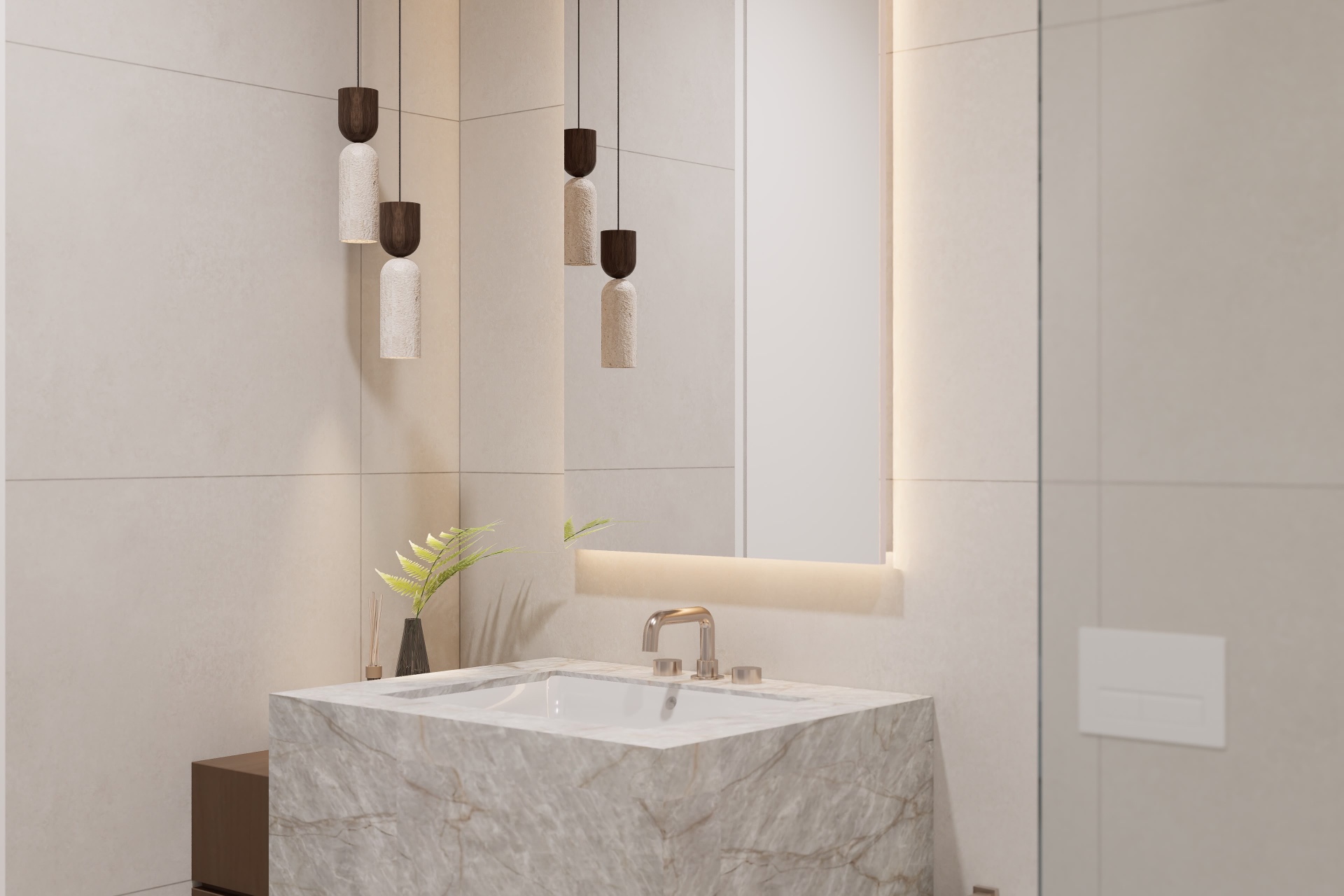 Powder room with solid marble basin block, travertine pendants and backlit mirror